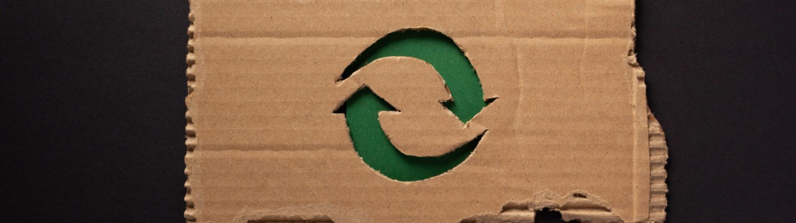 Recycle symbol at  recycled paper background texture. Recycling idea concept and cardboard paper